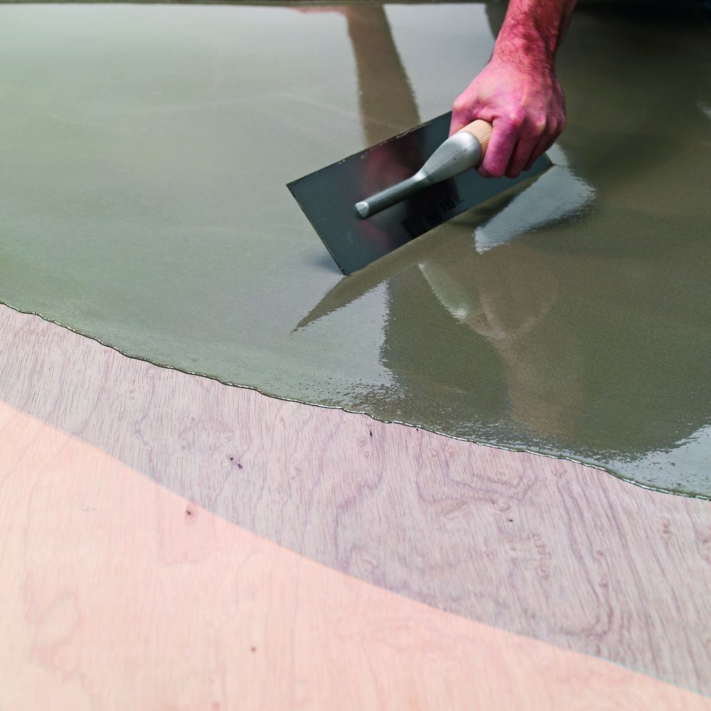 Fibre reinforced smoothing compound applied to plywood flooring