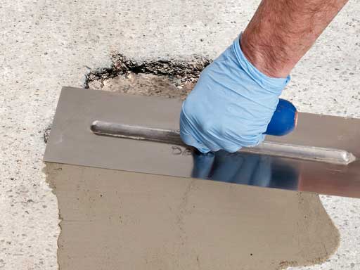 Repair any holes or cracks in the concrete